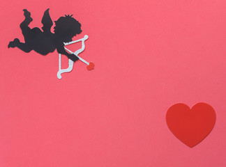 Table top view  aerial image of sign of valentines 's day background concept.DIY photo booth props the cupid shoot arrow to red heart on modern rustic pink wallpaper at home office desk studio.