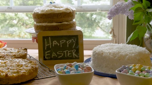 Homemade desserts and a sign that says happy Easter on a small chalk board