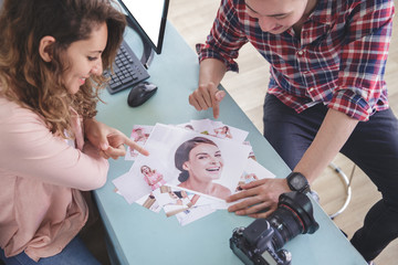 two photographer pointing at their photo result