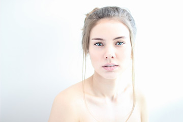 portrait of a girl in high key on white background