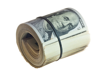 A large roll of hundred dollar bills knitted by a black rubber band isolated on white background.