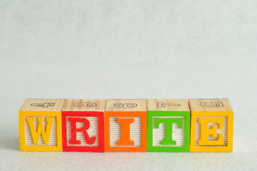 The word write spelled with colorful blocks isolated on a white background