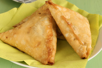 Samosas a spicy blend of vegetables or meat in a deep fried pastry parcel