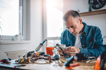 Men working with electronic components