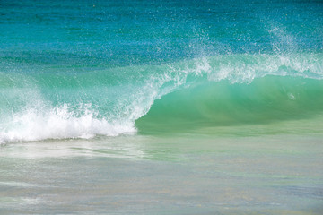 Waves breaking on sand beach in Boa Vista, Cape Verde