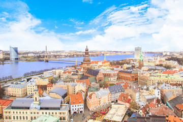 eautiful view of the old town and the steeple of the Dome Cathedral near the Daugava River in Riga, Latvia