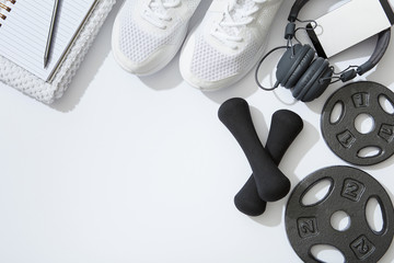 Fitness flat lay, unisex sports equipment on white background