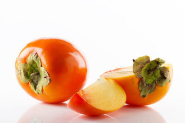 Ripe juicy and tasty persimmon fruit and their close-up