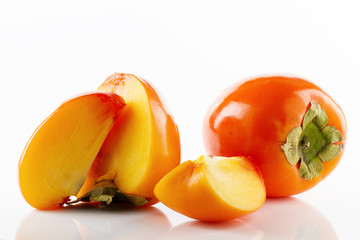 Ripe juicy and tasty persimmon fruit and their close-up