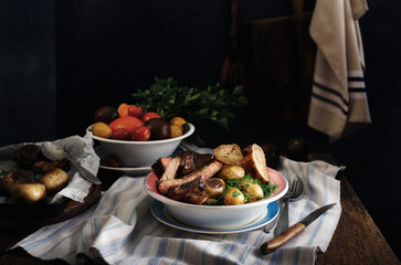 Plate of grilled beef steak and fried potatoes. Rustic style