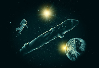 Astronaut with mysterious alien object Oumuamua in space