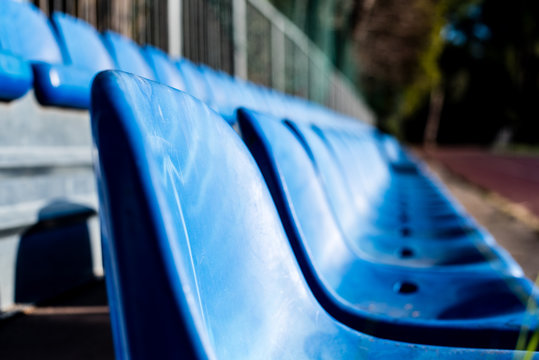 Empty Blue Stand Seats On Sport Playground