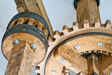 historical gears in wood and metal with wheels and teeth