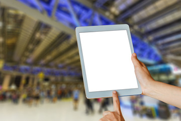 woman hand hold and touch screen tablet over garage or car service center