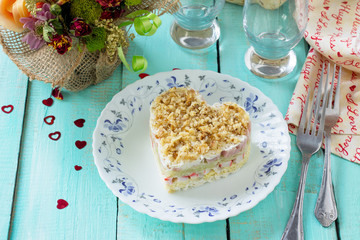 Salad with crab sticks, apples and ham on the festive table on Valentine's Day.