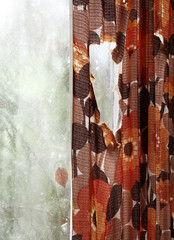 Old curtains in old, abandoned farm house in Southern Finland. Spruce behind the window. 