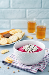 Beet hummus with Feta and black sesame