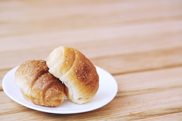 Homemade croissant . Delicious fresh croissant on wood table.