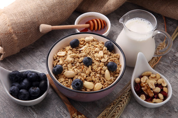 Oat flakes with milk, honey, blueberries, raspberries and nuts.