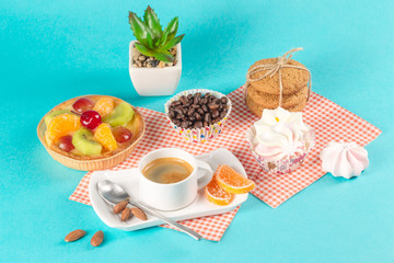 Cake, cups with coffee, cookies on a bright background