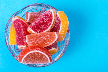 Fruit marmalade on bright colored background
