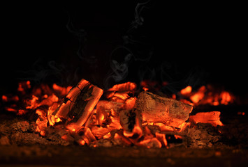 Smoldering embers in the fireplace