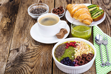 Espresso, croissant and fruit dessert for breakfast