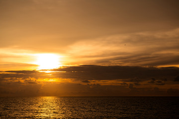 Beach sunset. Beach at sunset with ocean waves and dramatic high contrast filter. Taken at Thailand empty golden beach.
