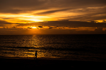 Obraz premium Beach sunset. Beach at sunset with ocean waves and dramatic high contrast filter. Taken at Thailand empty golden beach.