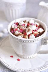 Thick hot chocolate with mini marshmallow and festive decoration.