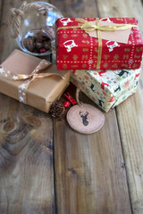christmas presents on a brown wooden background