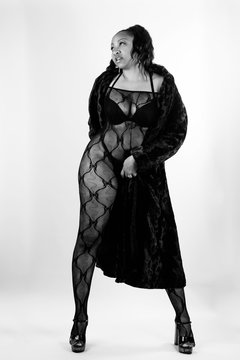Sexy African American Woman In Lingerie Bodysuit and Fur Coat