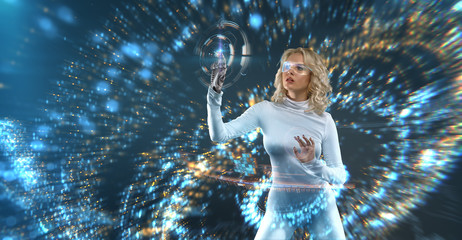 Attractive Blonde model in futuristic environment working with virtual hud interface