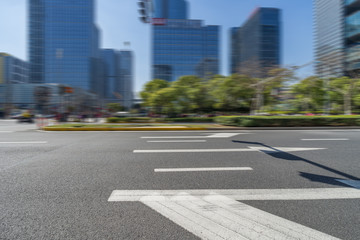 city empty traffic road with cityscape in background.