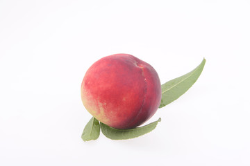 Fresh peaches in a white background