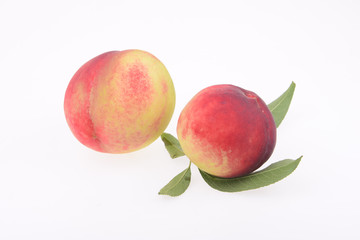 A few fresh peach on a white background