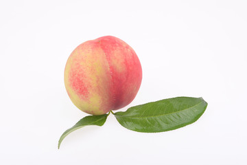 Fresh peaches in a white background