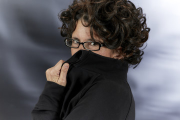 Middle Aged Woman with Curly Hair wearing Eyeglasses