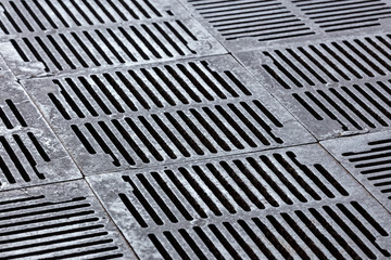 sidewalk subway sewer grate with shallow depth of field