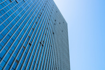 Modern office building against blue sky.