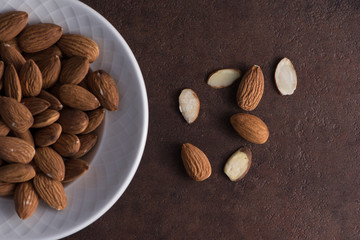 Whole almonds in white bowl