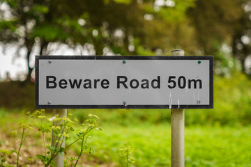 Sign: Beware road 50m, seen near Bawdsey, Suffolk, England, UK