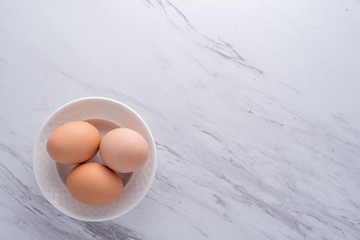 Eggs in white bowl