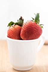 Strawberries in a white mug