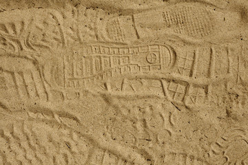 marks from shoes on the sand