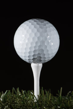 Golf ball standing on tee