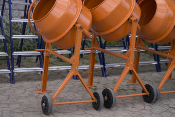 orange concrete mixer on wheels
