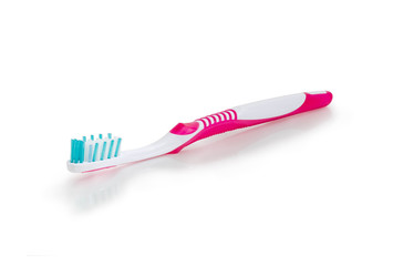 Toothbrush on a white matte surface closeup