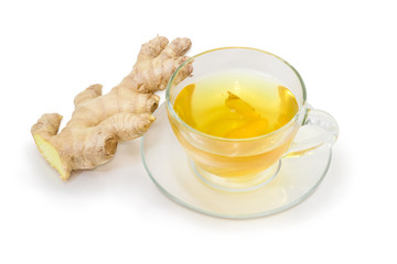 Ginger tea in glass cup and fresh ginger root