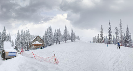 Fototapeta na wymiar Mountain slope with ski pistes on ski resort in Carpathians